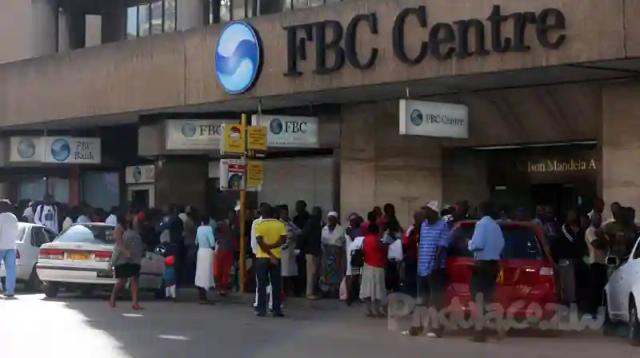 Long queues outside banks as people try to withdraw money for Christmas