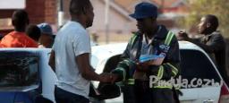 Magistrate threatens to revoke bail of 6 traffic cops on trial after they try to intimidate witness