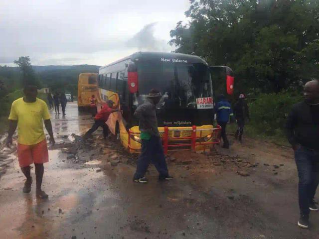 PICTURES: Bus Stuck In The Road As Tarred Road Gives In #CycloneIdai