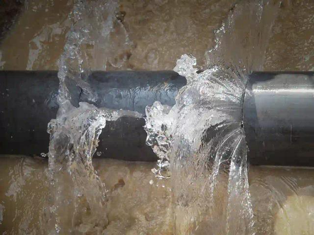 PICTURES: ZINWA Digs Through Building To Repair Pipe Burst 