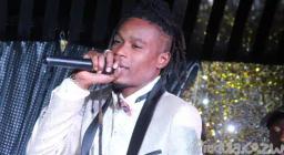 Soul Jah Love performs in wheelchair after being discharged from hospital