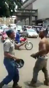 WATCH: Shirtless 'Thug' Overpowers  Anti-riot Police Officer In Harare
