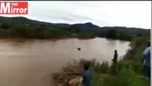 WATCH: Villagers Float A Coffin With A Dead Body Across A Flooded River In Nyanga