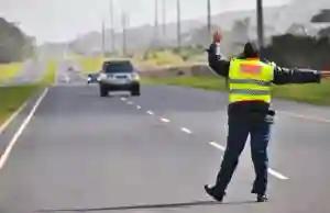 Zimbabwean Man Sitting Behind Wheel Of Marked SAPS Car Invites Sharp Warning From SA Police
